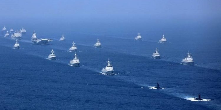 資料圖,2018年中共在南海舉行大規模軍演。 (圖片來源:美聯社)