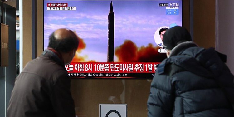 SEOUL, SOUTH KOREA - JANUARY 05: People watch a TV at the Seoul Railway Station showing a file image of a North Korean missile launch, on January 05, 2022 in Seoul, South Korea. North Korea on Wednesday fired what appears to be a ballistic missile toward the East Sea, South Korea's military said, in the recalcitrant regime's first show of force this year. (Photo by Chung Sung-Jun/Getty Images)