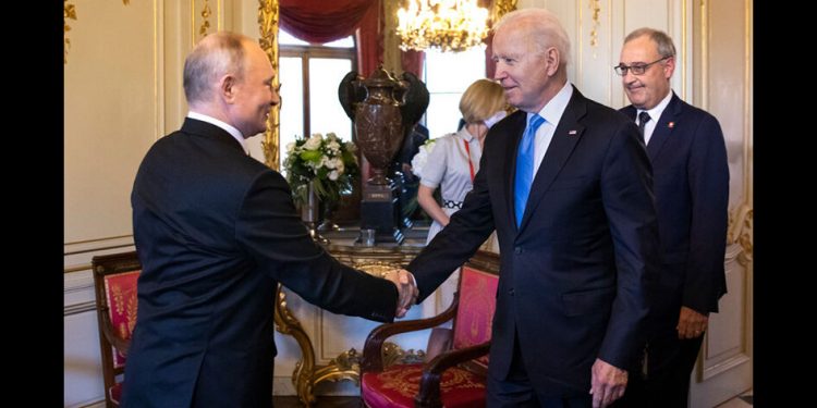 GENEVA, SWITZERLAND - JUNE 16: U.S. President Joe Biden (2L) and Russian President Vladimir Putin shake hands as Swiss President Guy Parmelin (R) looks on during the U.S.-Russia summit at Villa La Grange on June 16, 2021 in Geneva, Switzerland. Biden is meeting his Russian counterpart, Putin, for the first time as president in Geneva, Switzerland. (Photo by Peter Klaunzer - Pool/Keystone via Getty Images)
