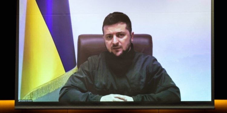 TOKYO, JAPAN - MARCH 23: Ukrainian President Volodymyr Zelensky addresses Japan's lower house of parliament via video link at the House of Representatives office building on March 23, 2022 in Tokyo, Japan. Zelensky spoke via video link to Japan's lower house - the more powerful of the country's two-chamber parliament - as he continues to rally for international support against the Russian invasion of Ukraine. (Photo by Behrouz Mehri - Pool/Getty Images)