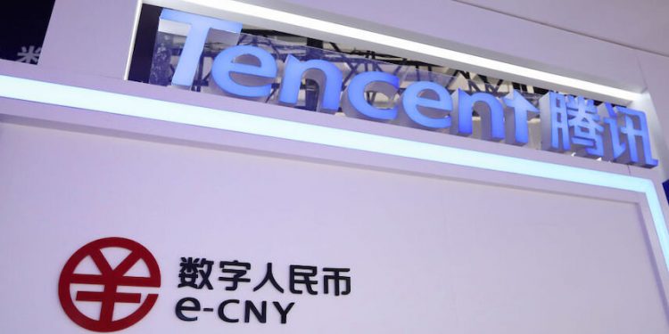 BEIJING, CHINA - SEPTEMBER 01: An e-CNY (China's digital currency) logo and a Tencent logo are seen before the 2021 China International Fair For Trade in Services (CIFTIS) at Shougang Park on September 1, 2021 on Beijing, China. The 2021 CIFTIS will be held and Shougang Park at Shougang Park on September 2-7. (Photo by VCG/VCG via Getty Images)