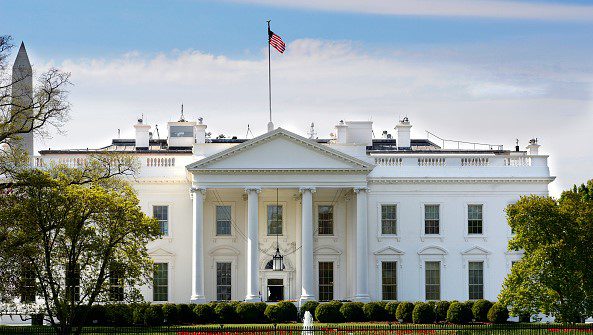 WASHINGTON, D.C. - APRIL 22, 2018: The American flag flies over the North Portico of the White House in Washington, D.C. (Photo by Robert Alexander/Getty Images)