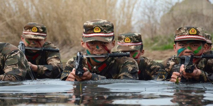 CHUZHOU, CHINA - MARCH 30: (CHINA OUT) Armed police commandos train in water on March 30, 2016 in Chuzhou, Anhui Province of China. (Photo by Getty Images)