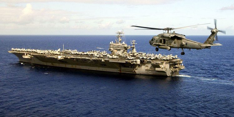 APRA HARBOR, GUAM - FEBRUARY 25: (EDITORS NOTE: Image has been reviewed by U.S. Military prior to transmission.) In this handout image provided by the U.S. Navy, the Nimitz-class aircraft carrier USS Carl Vinson (CVN 70) departs Naval Station Mariannas, Guam, after a four-day port vist February 25, 2009 off the coast of Guam. Carl Vinson is underway following a four-year refueling and complex overhaul to take part in Southern Seas 2010. After completing Southern Seas, Carl Vinson will change homeport from Norfolk, Va. to San Diego, Calif. (Photo by Petty Officer 2nd Class Dusty Howell/U.S. Navy via Getty Images)