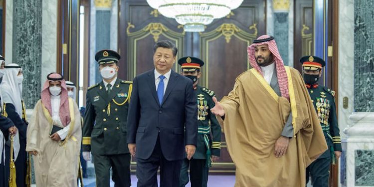 RIYADH, SAUDI ARABIA - DECEMBER 8: (----EDITORIAL USE ONLY â MANDATORY CREDIT - 'ROYAL COURT OF SAUDI ARABIA / HANDOUT' - NO MARKETING NO ADVERTISING CAMPAIGNS - DISTRIBUTED AS A SERVICE TO CLIENTS----) Chinese President, Xi Jinping (C) meets by Crown Prince of Saudi Arabia Mohammed bin Salman Al Saud (R) following an official welcoming ceremony at the Palace of Yamamah in Riyadh, Saudi Arabia on December 8, 2022. Chinese President Jinping is in Saudi Arabia to attend China-Arab States Summit and the China-Gulf Cooperation Council (GCC) Summit. (Photo by Royal Court of Saudi Arabia/Anadolu Agency via Getty Images)