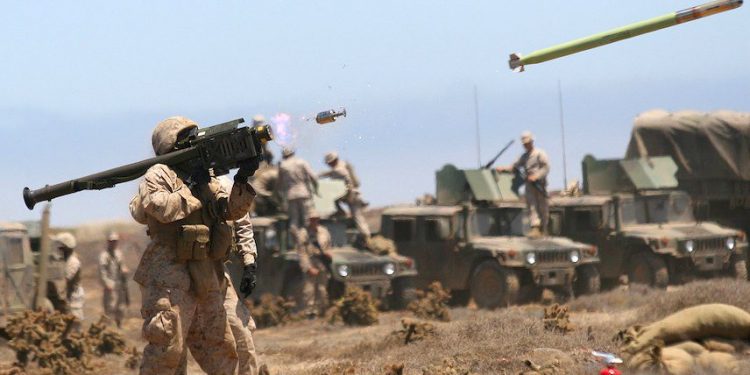 SAN CLEMENTE ISLAND, Calif. - Sgt. Joshua J. Stepp a firing pit noncommissioned officer with 3rd Low Altitude Air Defense Battalion coaches a Marine as he fires an FIM-92A Stinger missile at an unmanned aerial target during training at San Clemente Island, July 28. The unmanned aerial targets contained a catalytic converter that provided a heat signature necessary for the missile to lock on to. (Official U.S. Marine Corp photo by Cpl. Christopher O'Quin)(Released)