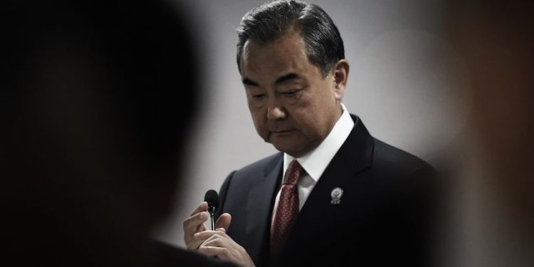 China's Foreign Minister Wang Yi prepares to speak at a press conference on the sidelines of the 52nd Association of Southeast Asian Nations (ASEAN) Foreign Ministers' Meeting in Bangkok on July 31, 2019. (Photo by Lillian SUWANRUMPHA / AFP) (Photo credit should read LILLIAN SUWANRUMPHA/AFP via Getty Images)