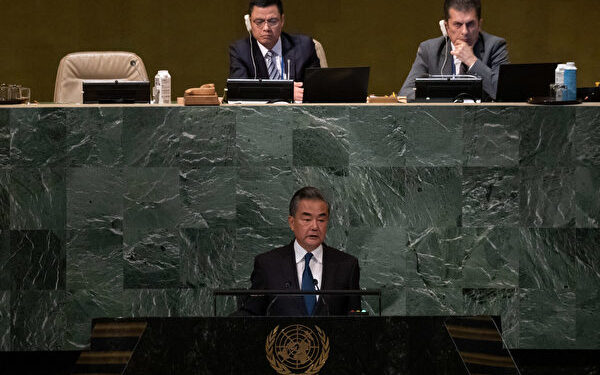 Chinas Foreign Minister Wang Yi addresses the 77th session of the United Nations General Assembly at UN headquarters in New York City on September 24, 2022. - China on Saturday at the UN urged Russia and Ukraine not to let effects of their war "spill over" and called for a diplomatic resolution. "We call on all parties concerned to keep the crisis from spilling over and to protect the legitimate rights and interests of developing countries," Wang said in his address . (Photo by Yuki IWAMURA / AFP)