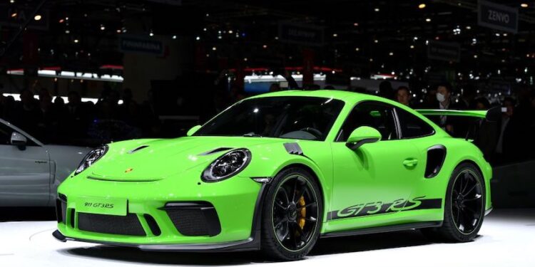 TOPSHOT - The new Porsche 911 GT3 RS is displayed at the car maker's booth during a press day ahead of the Geneva International Motor Show on March 6, 2018 in Geneva. - The show opens to the public on March 8 and runs through March 18. (Photo by HAROLD CUNNINGHAM / AFP) (Photo by HAROLD CUNNINGHAM/AFP via Getty Images)