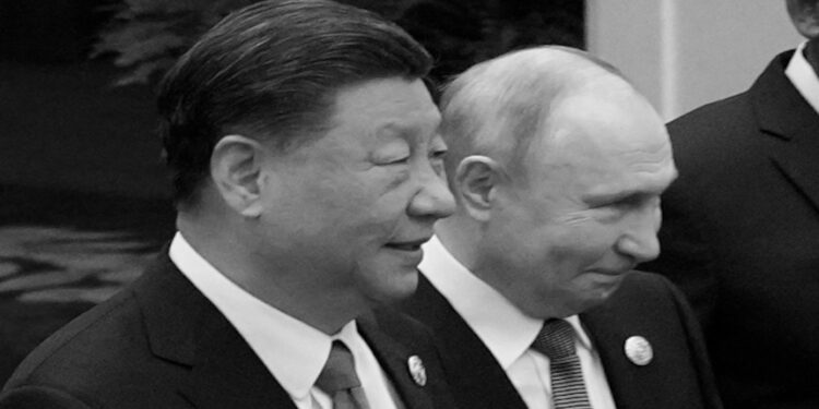 BEIJING, CHINA - OCTOBER 18:  Chinese President Xi Jinping (L) and Russian President Vladimir Putin prepare for a group photo with other leaders at the Third Belt and Road Forum on October 18, 2023 in Beijing, China. (Photo by Suo Takekuma-Pool/Getty Images)
