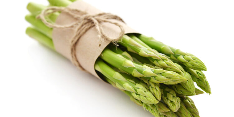 Fresh green asparagus isolated on white background