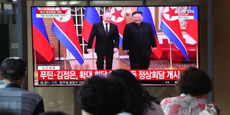 SEOUL, SOUTH KOREA - JUNE 19: People watch a television broadcast reporting a meeting between North Korean leader Kim Jong Un and Russian President Vladimir Putin at the Seoul railway station on June 19, 2024 in Seoul, South Korea. Russian President Vladimir Putin and North Korean leader Kim Jong-un began summit talks in Pyongyang, Russian news media reported, amid concerns about deepening military cooperation. (Photo by Chung Sung-Jun/Getty Images)