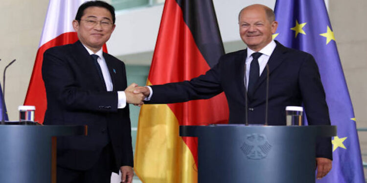 BERLIN, GERMANY - JULY 12: German Chancellor Olaf Scholz (R) and Japanese Prime Minister Fumio Kishida (L) shake hands at the end of a press conference, following talks at the Chancellery on July 12, 2024 in Berlin, Germany. The two leaders are meeting to discuss a range of bilateral issues including common economic security. (Photo by Maryam Majd/Getty Images)