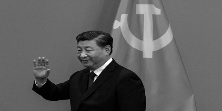 BEIJING, CHINA - OCTOBER 23: General Secretary and Chinese President Xi Jinping waves as he arrives for a press event with Members of the new Standing Committee of the Political Bureau of the Communist Party of China and Chinese and Foreign journalists at The Great Hall of People on October 23, 2022 in Beijing, China. (Photo by Kevin Frayer/Getty Images)