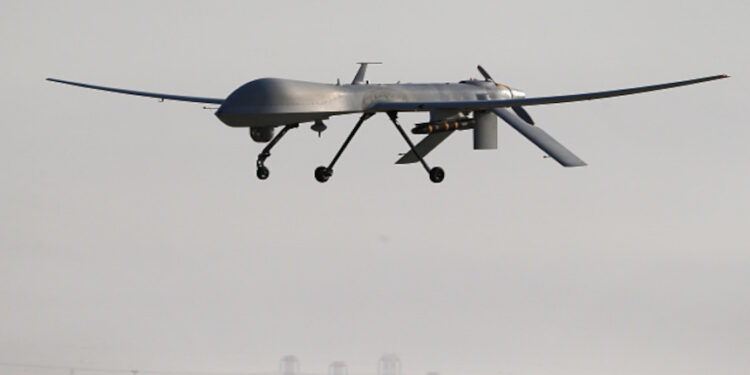 UNSPECIFIED, UNSPECIFIED - JANUARY 07: A U.S. Air Force MQ-1B Predator unmanned aerial vehicle (UAV), carrying a Hellfire missile lands at a secret air base after flying a mission in the Persian Gulf region on January 7, 2016. The U.S. military and coalition forces use the base, located in an undisclosed location, to launch airstrikes against ISIL in Iraq and Syria, as well as to distribute cargo and transport troops supporting Operation Inherent Resolve. The Predators at the base are operated and maintained by the 46th Expeditionary Reconnaissance Squadron, currently attached to the 386th Air Expeditionary Wing. (Photo by John Moore/Getty Images)