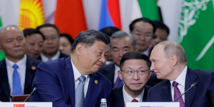 習近平與普京視頻會晤。（圖片來源：REUTERS/Maxim Shemetov/Pool）